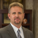 Picture of Hank Doyle of The Doyle Law Offices, a business website managed by TheeDigital