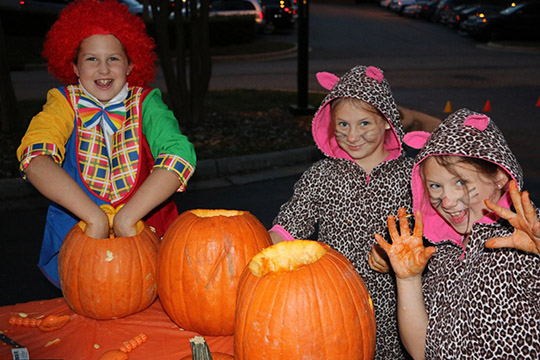 Halloween 2016 at TheeDigital - Raleigh Web Design and Digital Marketing - Kids carving pumpkins