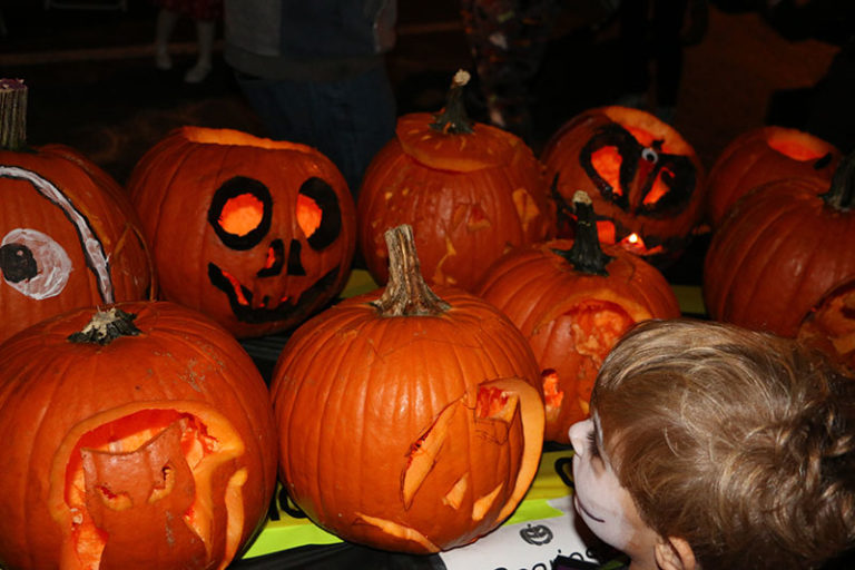 carved pumpkins on table