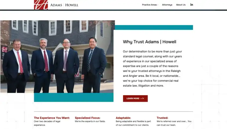 Group photo of Adams Howell attorneys outside their office building.